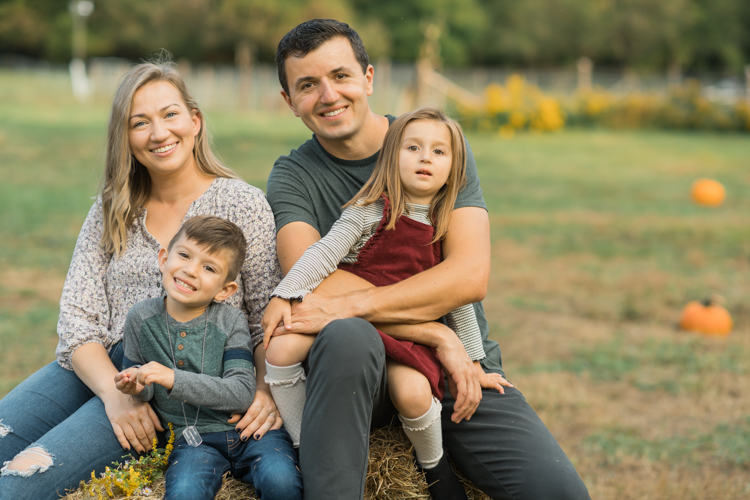 Fall is in full swing here in NJ, my first Fall Family session with Anna and Adam at their Farm House in Hackettstown NJ. Anna and Adam recently purchased their dream farm house on a 4 acres of land. This family of four now has chickens, ducks, birds, cats, a dog, sheep and plans to add many more to the list in the future. I had the honor of visiting Anna and Adam and their two beautiful children at their Farm the other day. I got much need vitamin D walking around the property, enjoying the foliage, running around with their kids and meeting all the farm animals. I sincerely enjoy photographing families now because there are no dull moments with kids, every moment is perfect! Fall family session at Anna and Adam’s Farm at Hackettstown NJ photographed by Karis from HeyKaris.